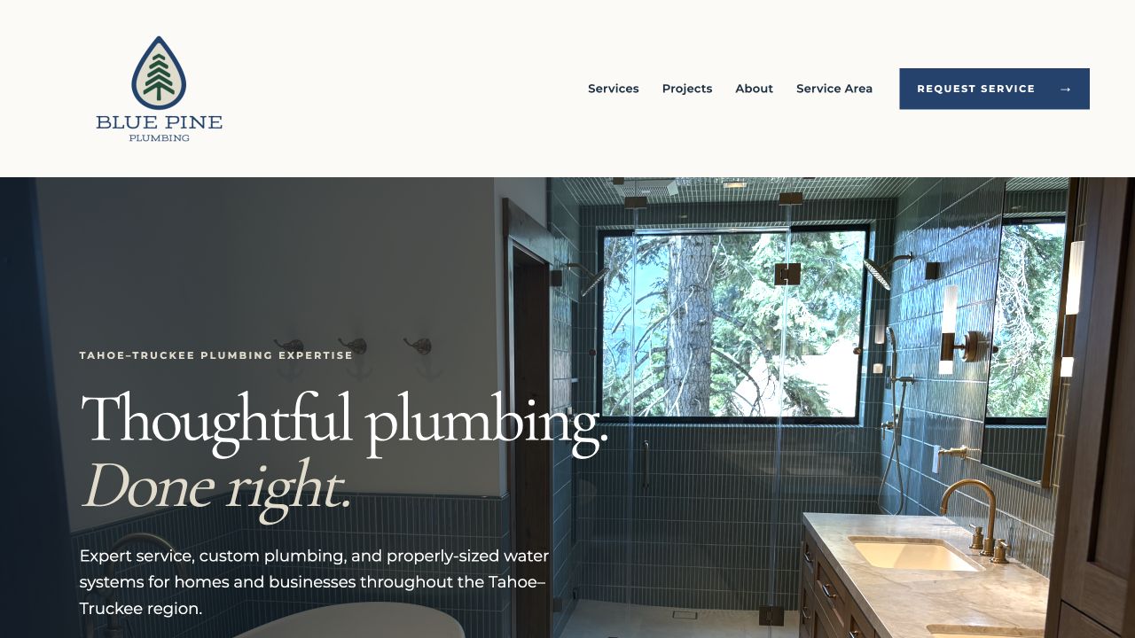 Blue Pine Plumbing website home page with navigation and a custom Tahoe bathroom hero image